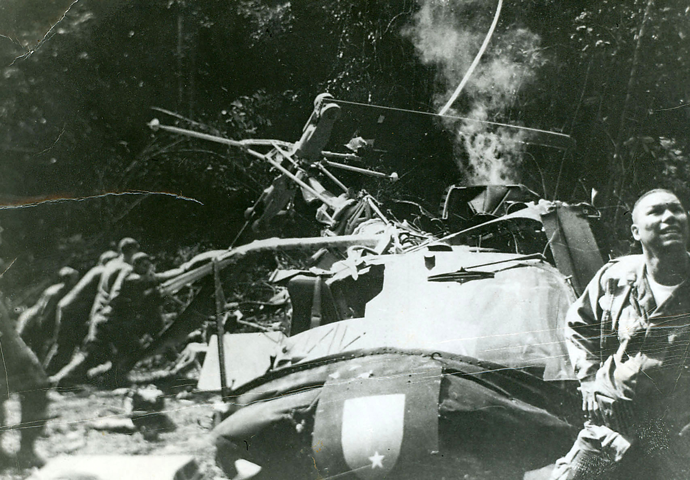 Colin in Vietnam with a helicopter after a crash-landing
